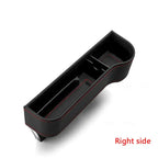 Black car armrest storage compartment with red stitching on a white background