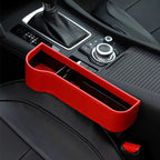 Red car cup holder extender on a car dashboard
