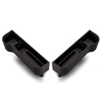 Two black car cup holders with red stitching on a white background